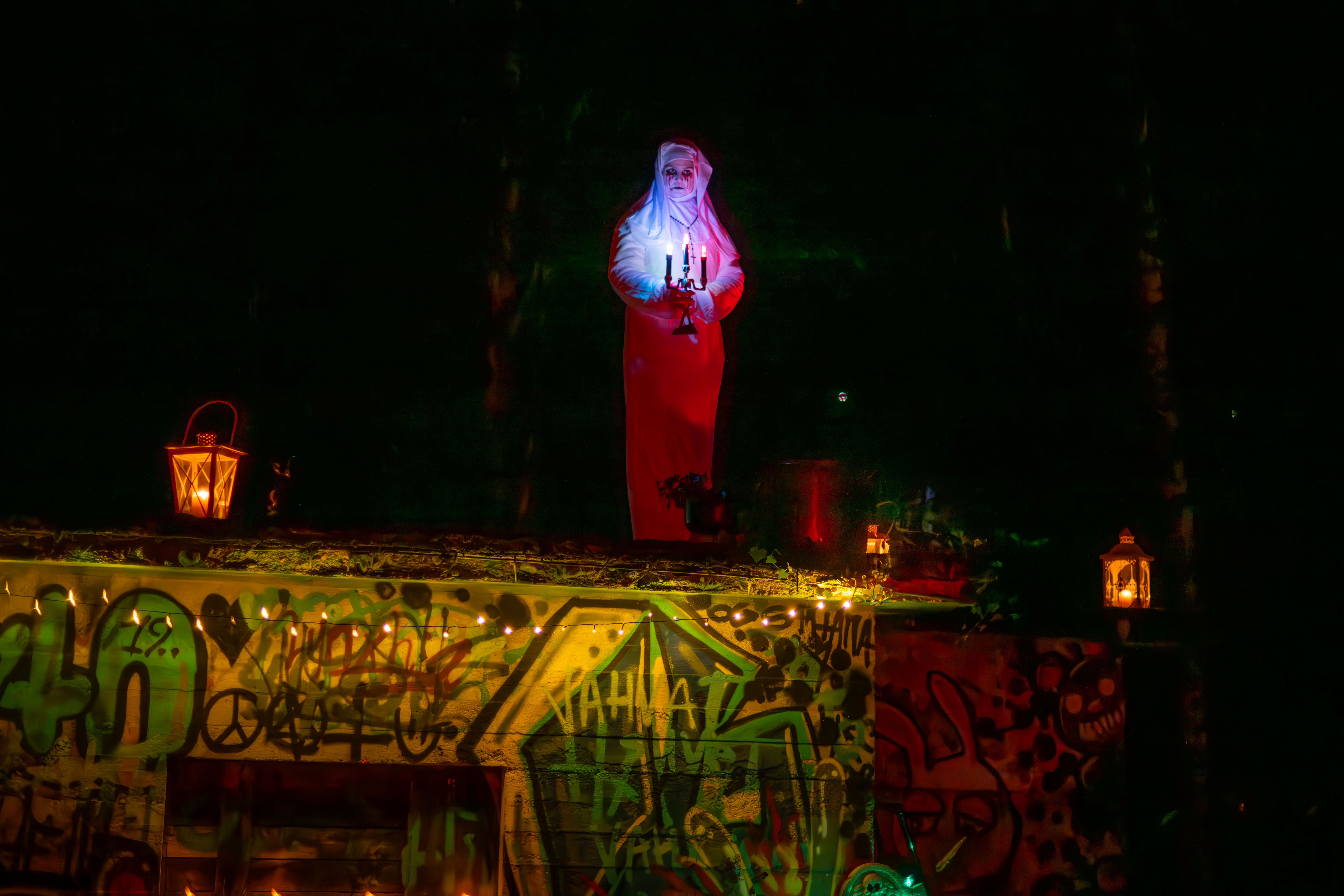 A person in a Halloween costume and Halloween decorations