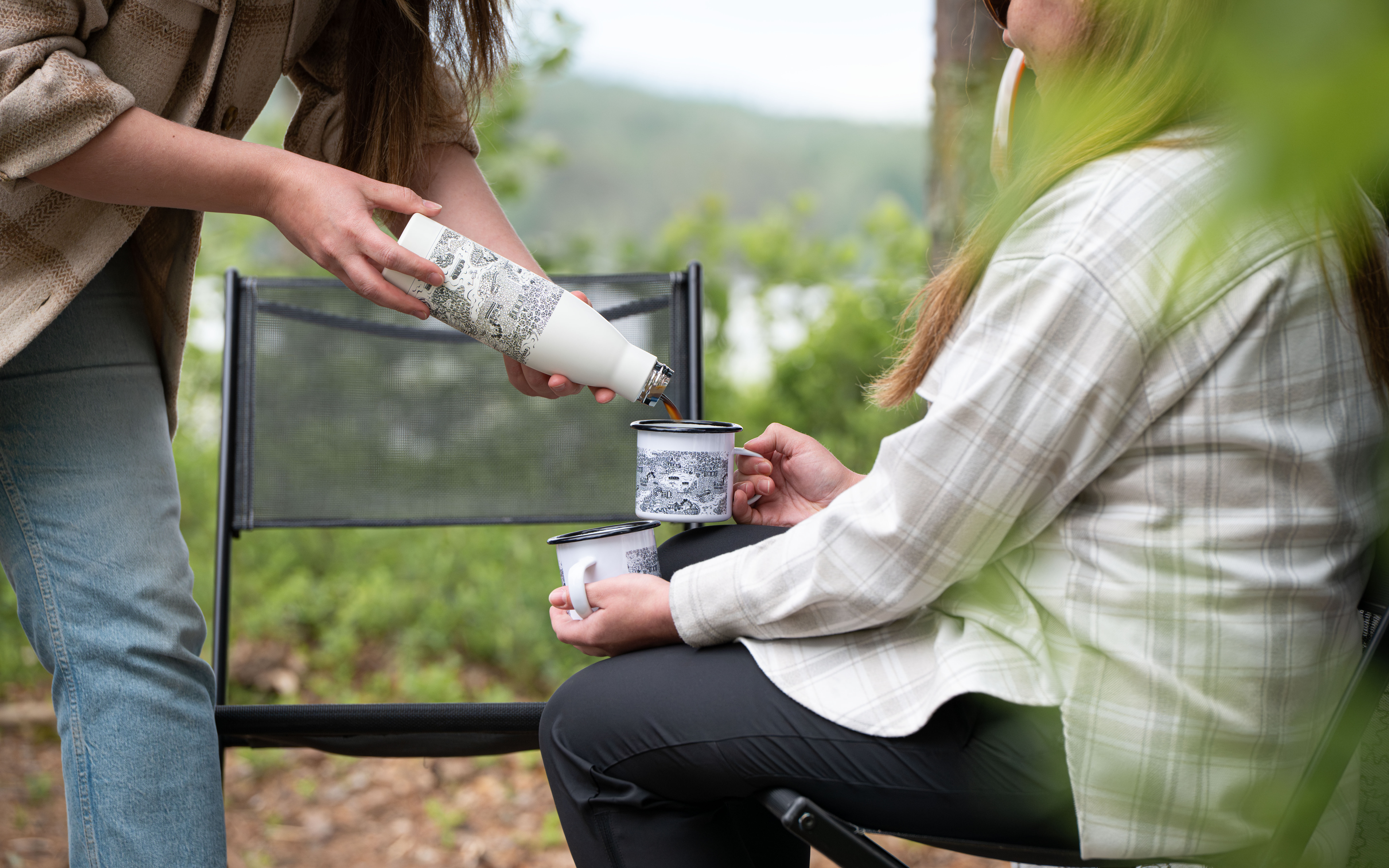 Pouring coffee into a mug.